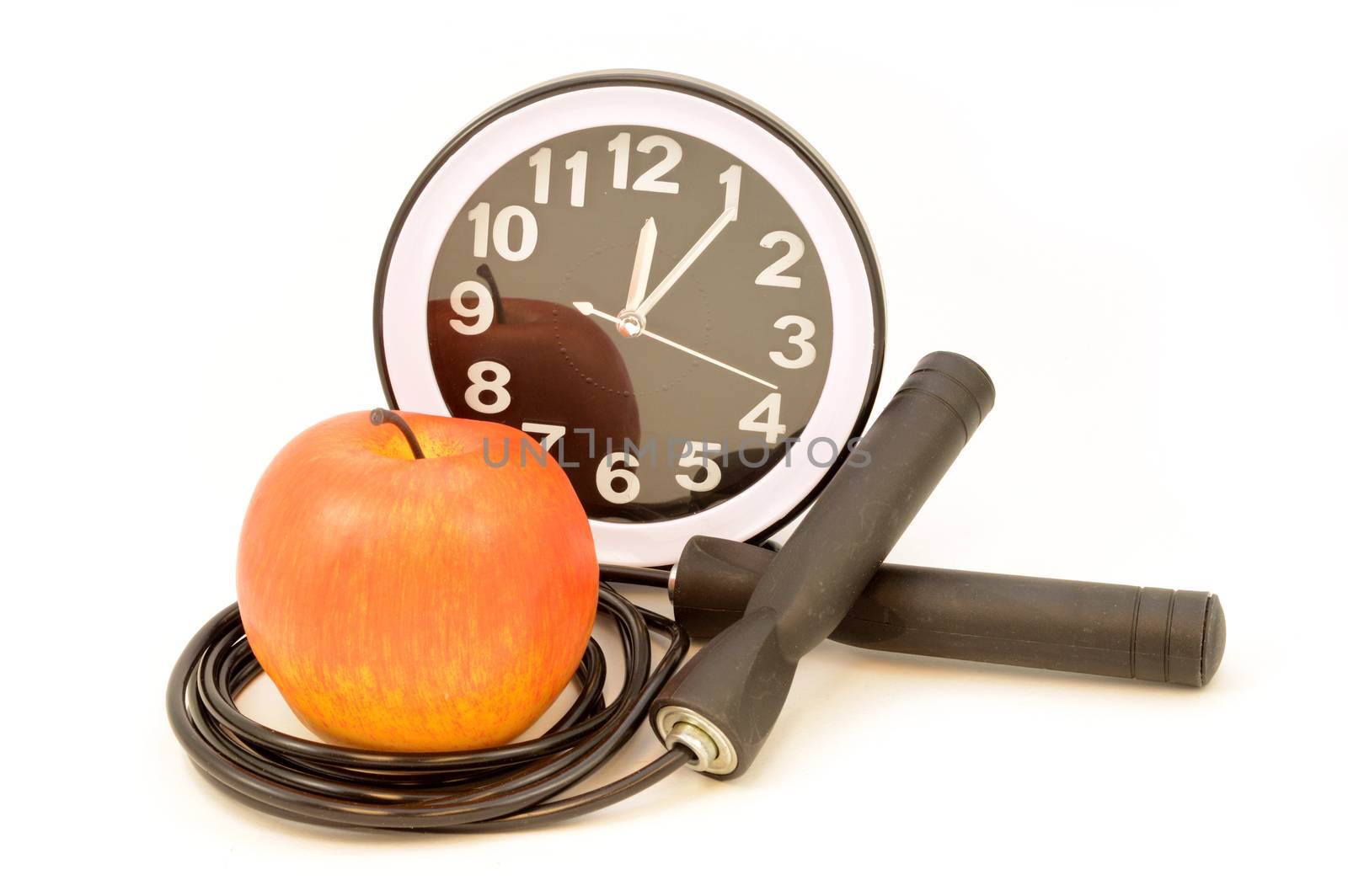 An isolated jump rope with an apple and clock for a variety of excersise concepts.