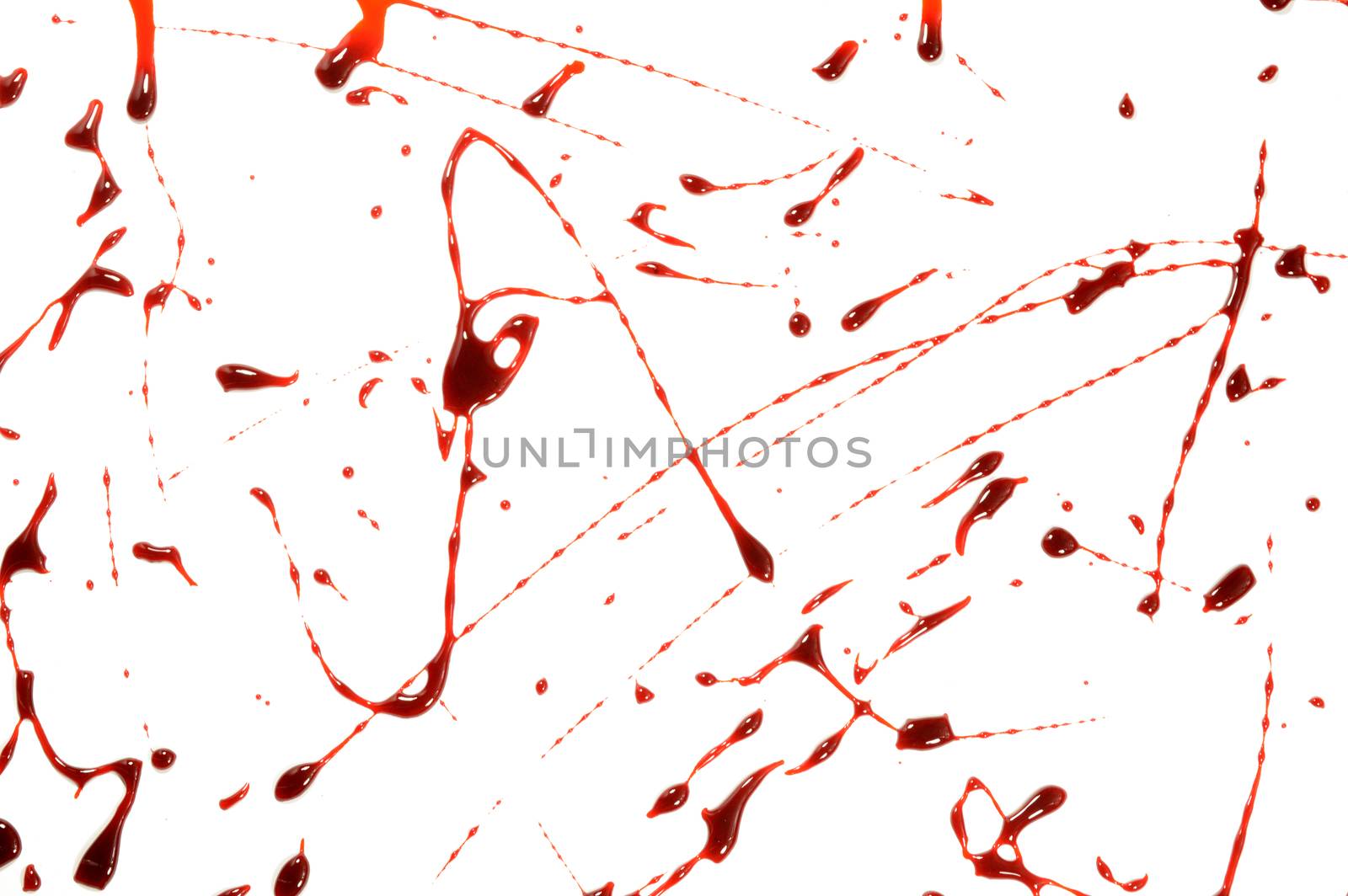 A closeup view of some fresh wet blood spatter over a white background.
