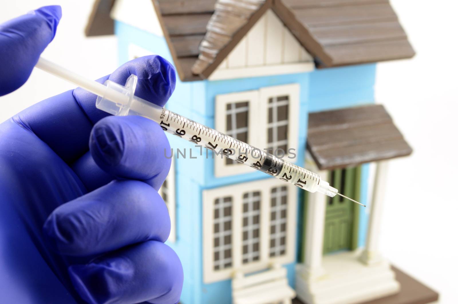 A concept of a medical professional preparing a vaccine for quarantine households affected by Covid-19 Coronavirus edpidemic.