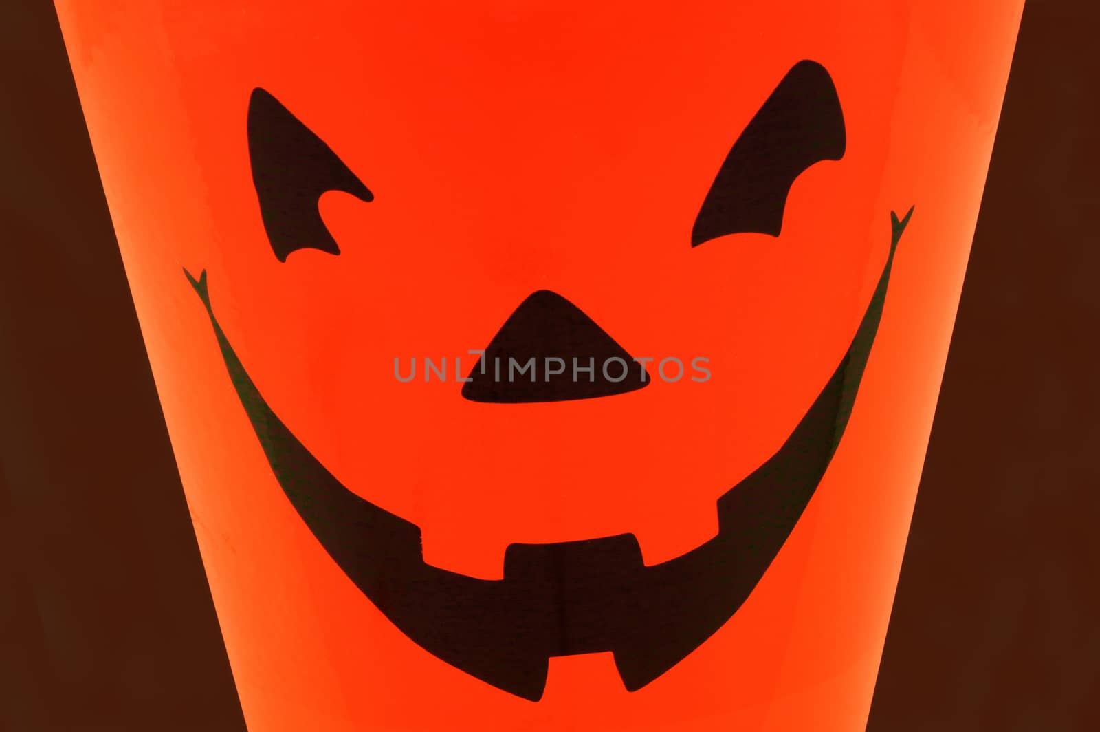 A Halloween pumpkin face closeup for the seasonal scare tactics.