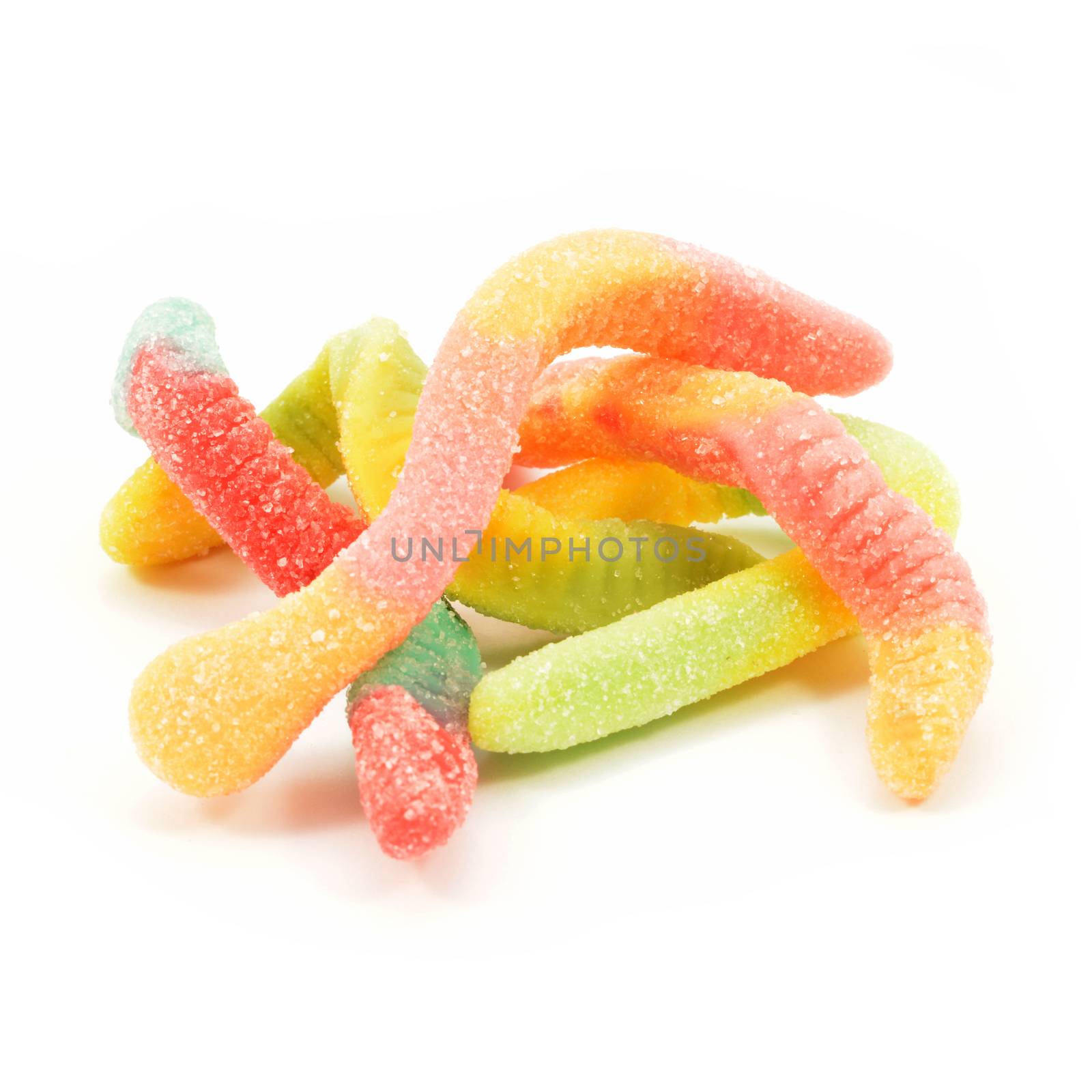 An isolated bunch of sour gummy worm candy over a white background.