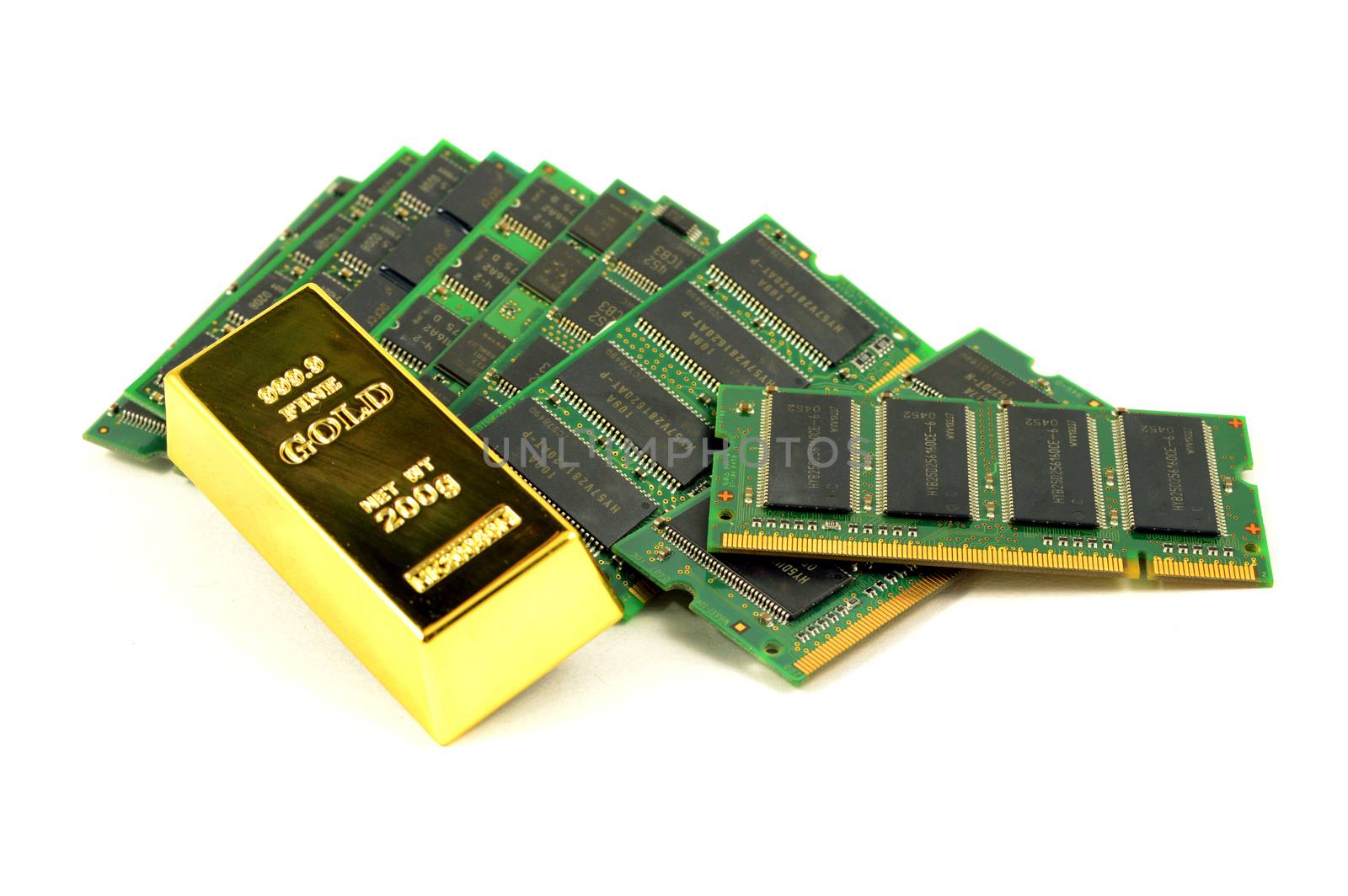 A pile of scrap computer RAM chips with a pure gold bullion bar to show that the precious metal can be recovered from electronic waste.