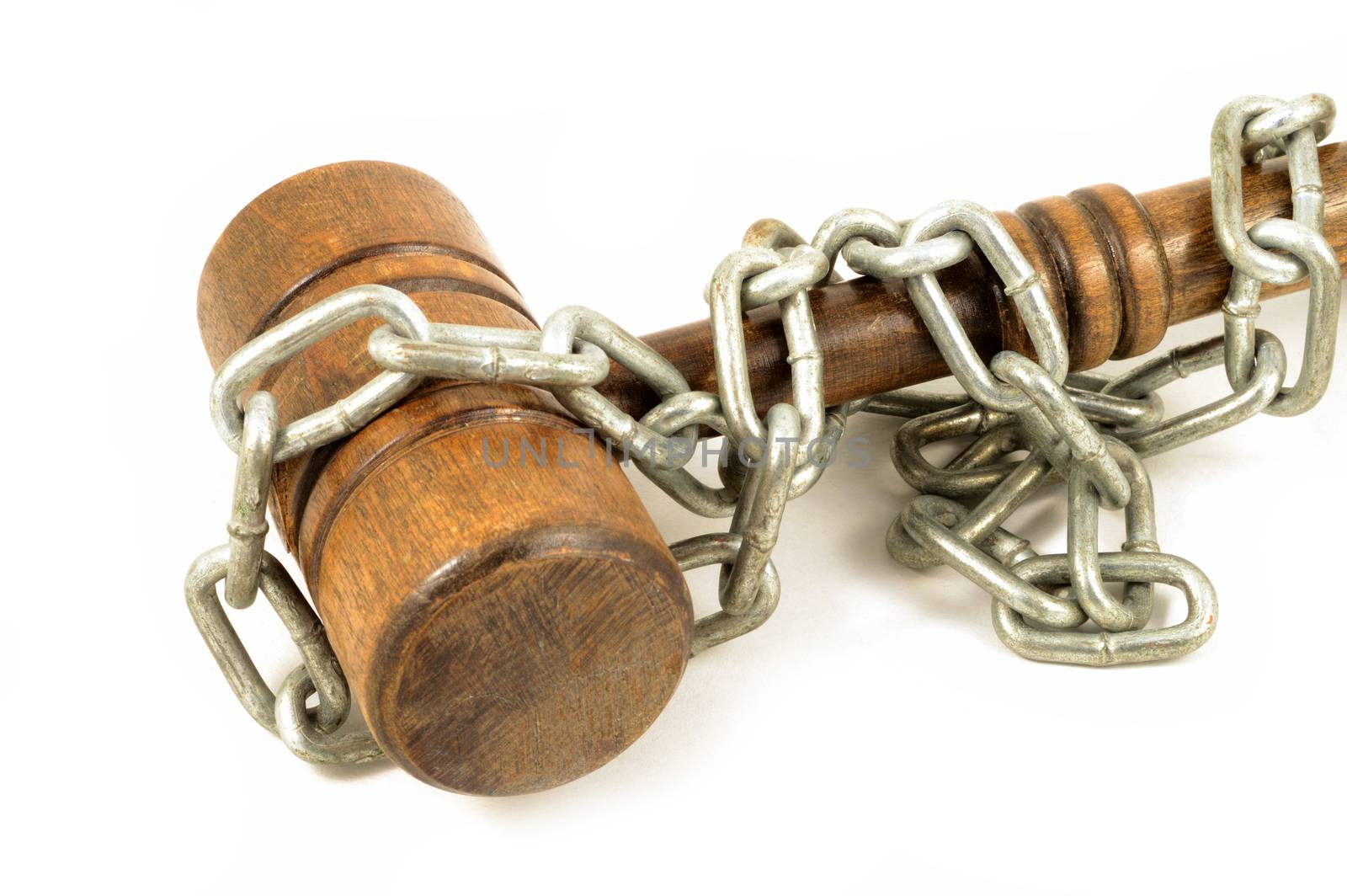 An shot over white background chain wrapped wood gavel for concepts related to law bindings and company policies.
