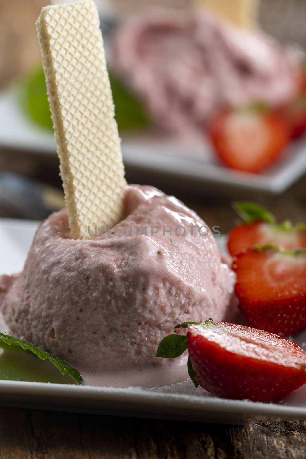 closeup of strawberry ice cream with waffle