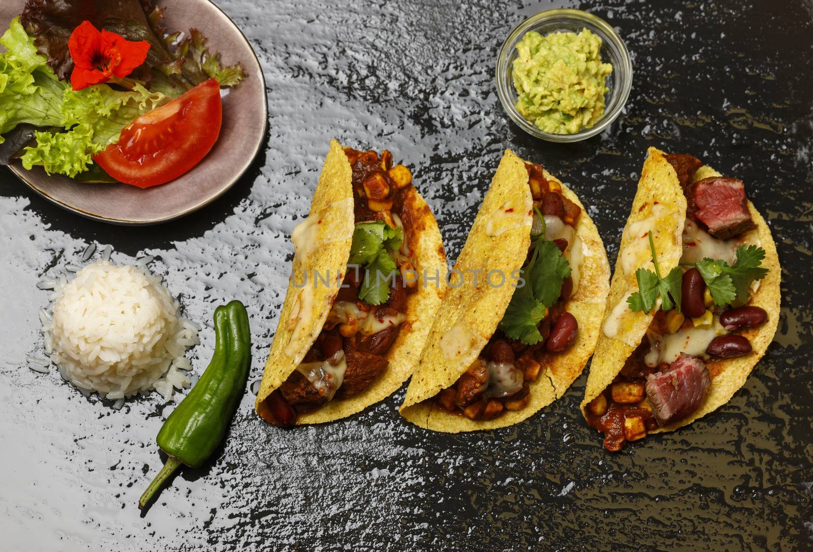 baked tacos on black slate