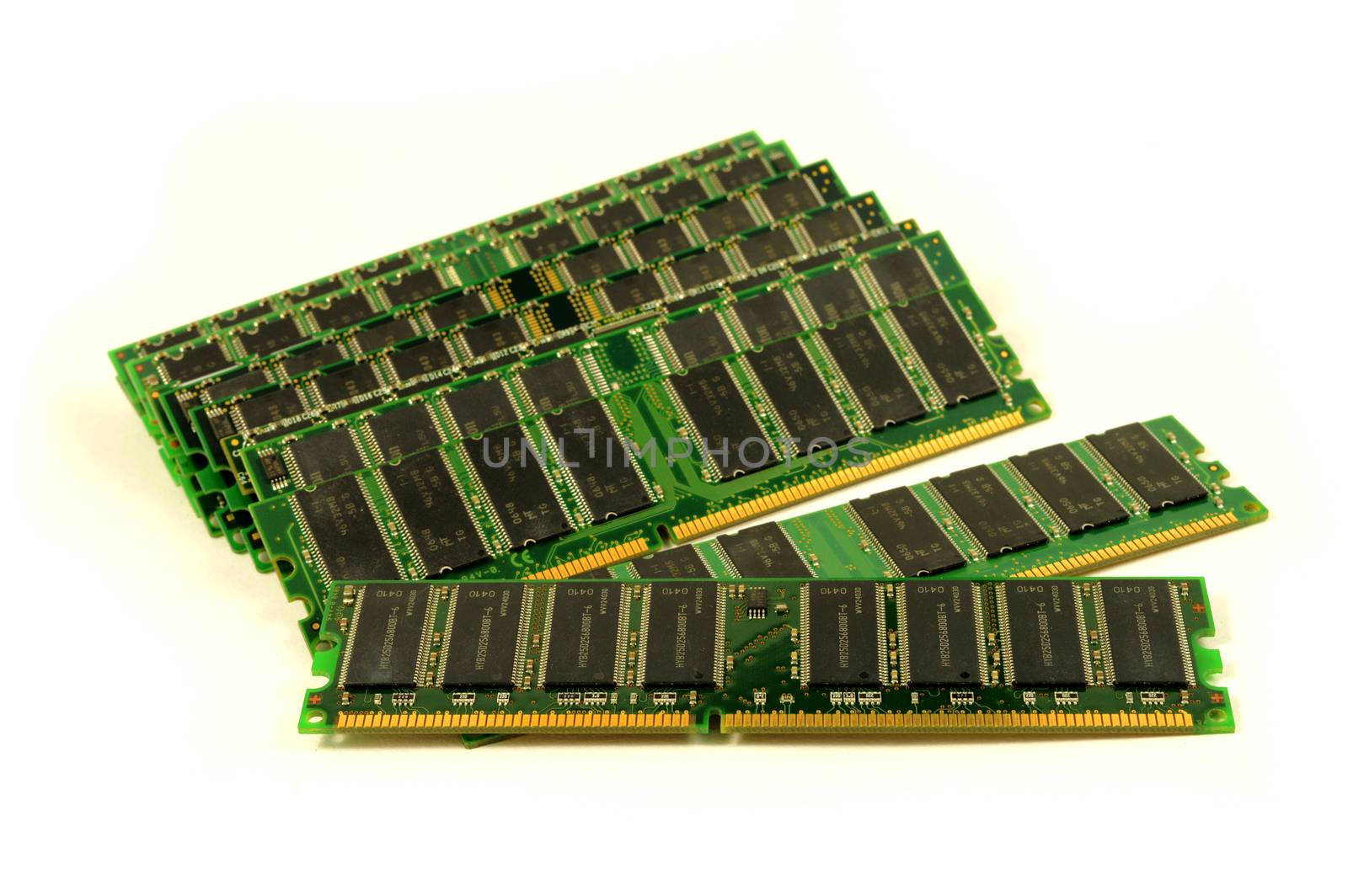 An isolated pile of computer RAM over a white background.