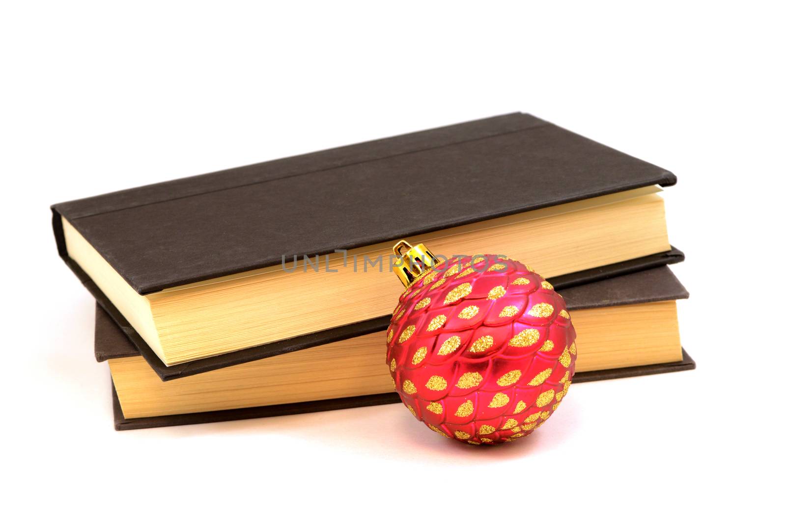 An isolated set of books and a Christmas bauble ornament for the holiday releases.