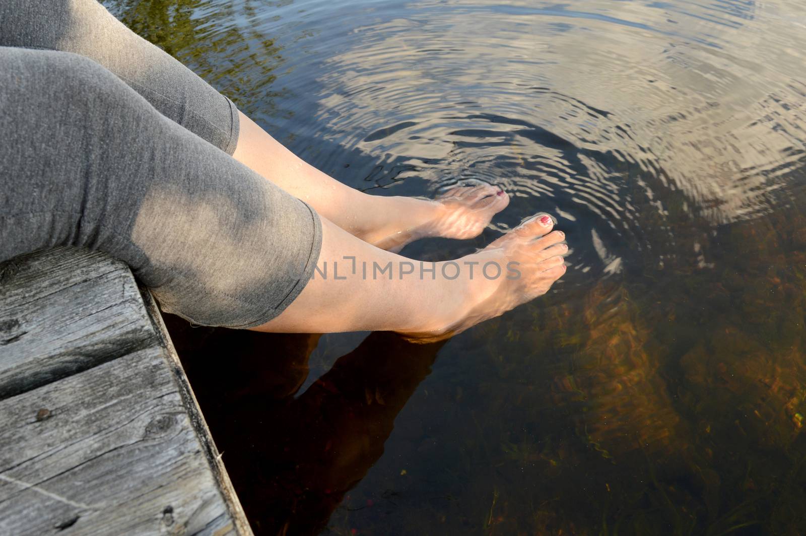 Splashing Feet at the Docks by AlphaBaby