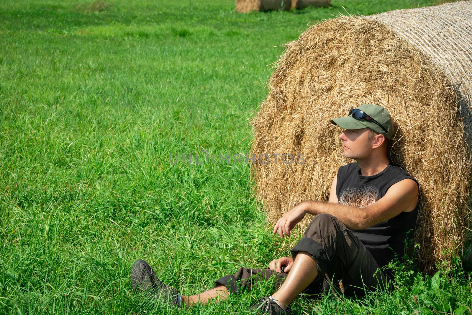 Sitting man to the meadow, based on a hay bale by darekb22