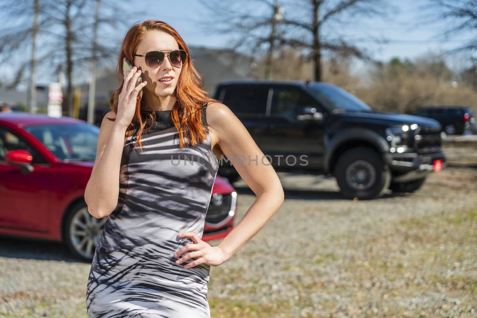 A gorgeous redhead model enjoys a spring day outdoors