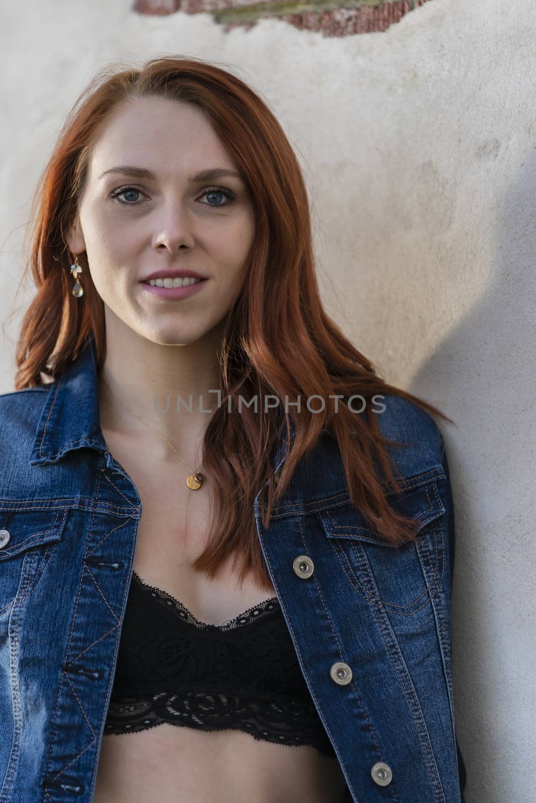 A Lovely Redhead Model Enjoys An Spring Day Outdoors by actionsports