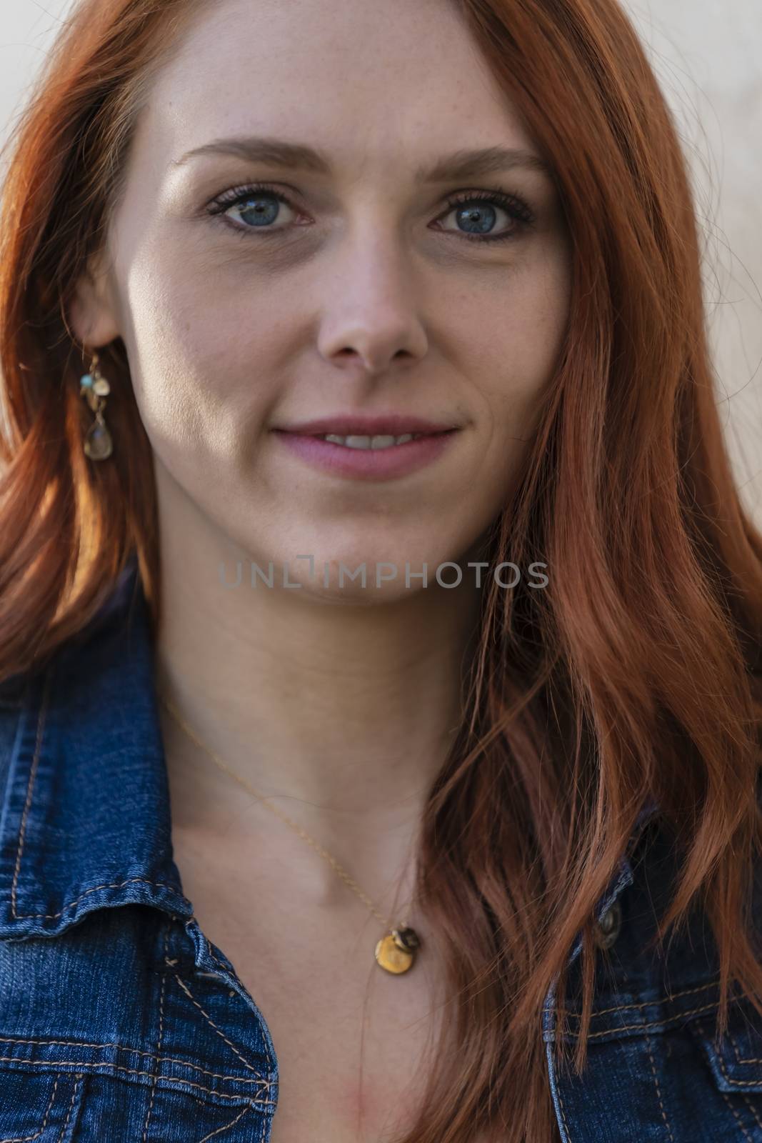 A Lovely Redhead Model Enjoys An Spring Day Outdoors by actionsports