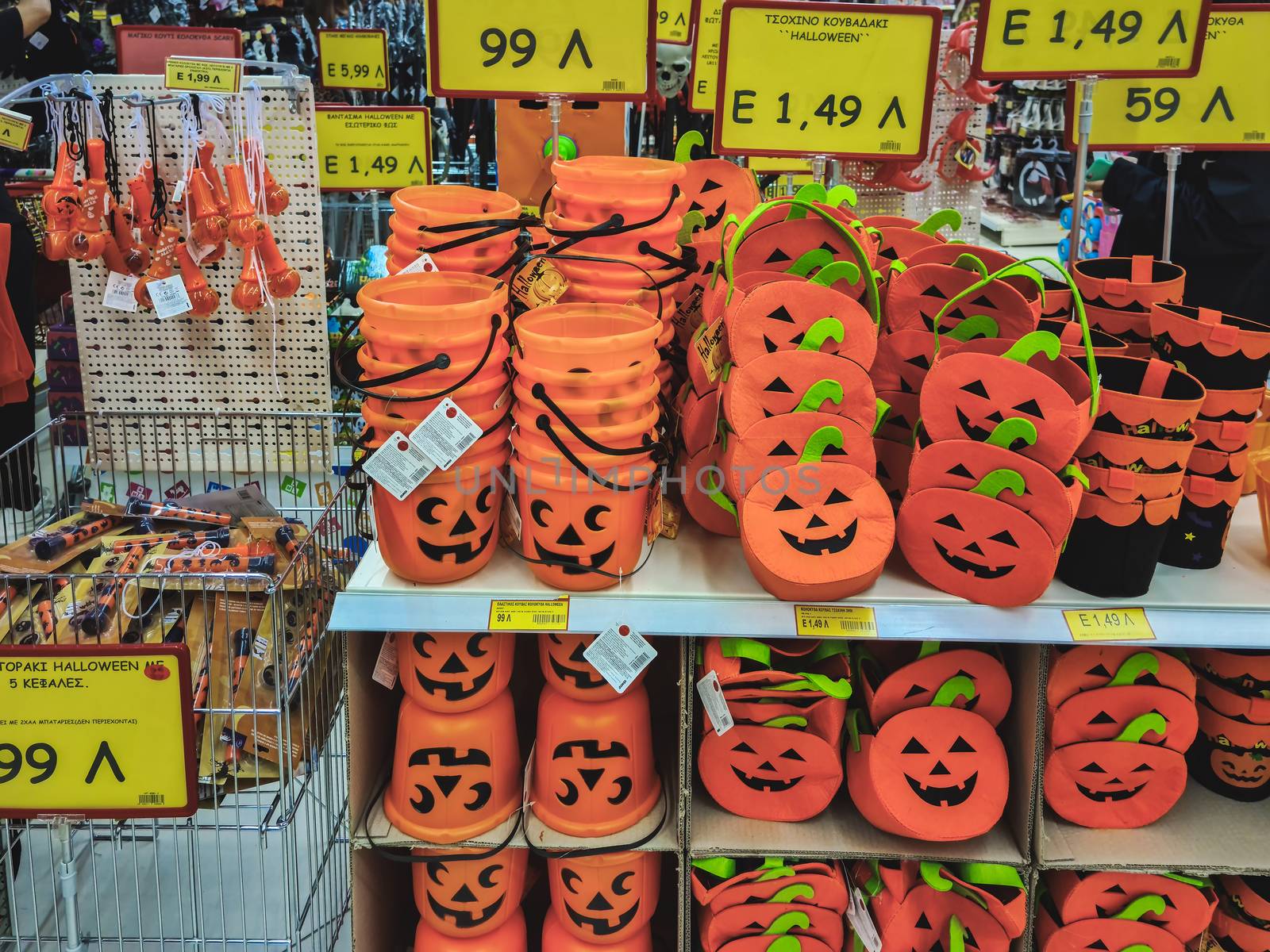 Festive decorations including pumpkin mock-ups, on display for sale inside shop gallery in Thessaloniki, Greece.