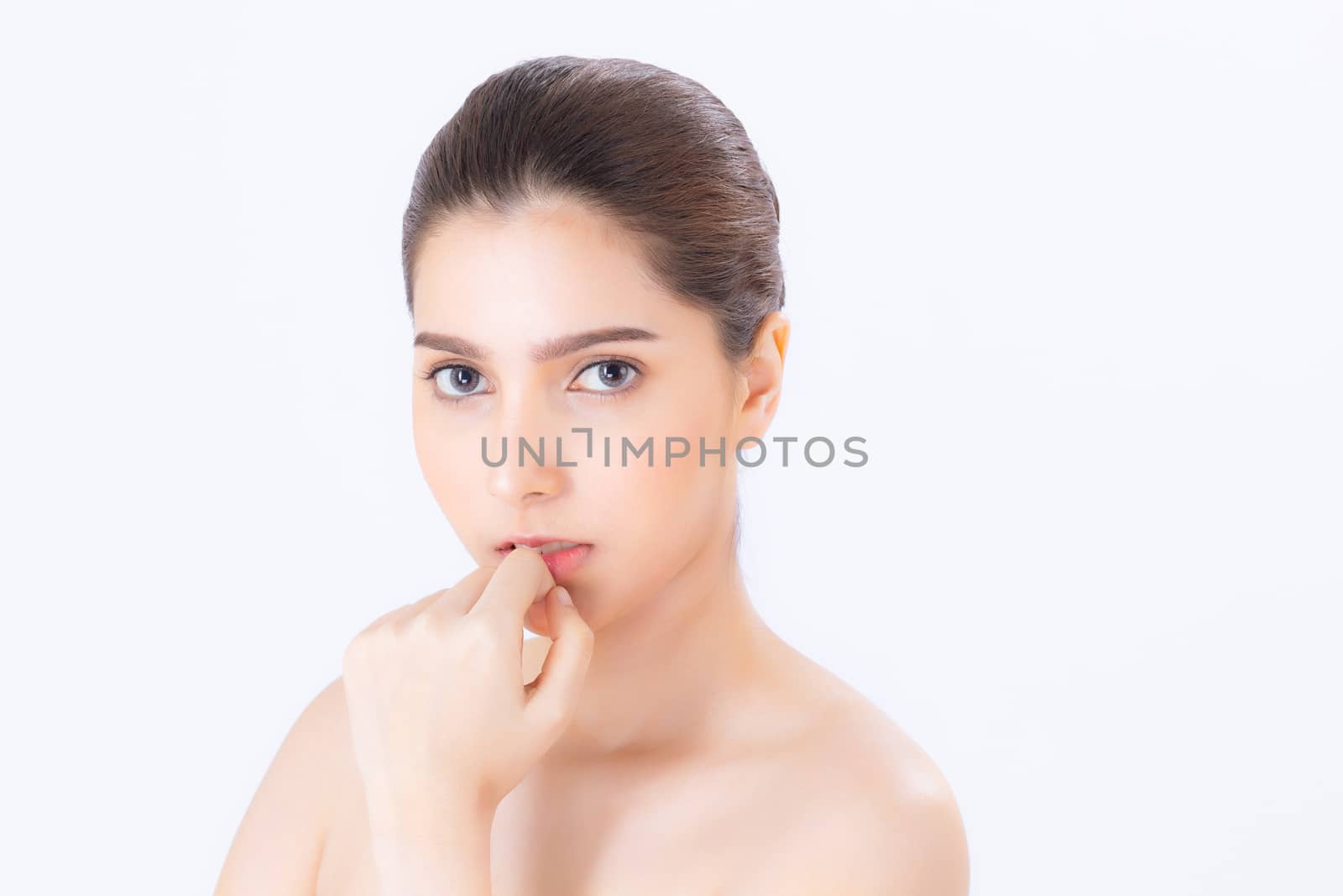 Portrait of beautiful brunette woman makeup of cosmetic, girl hand touch cheek and smile attractive, face of beauty perfect with wellness isolated on white background with skin healthcare concept.