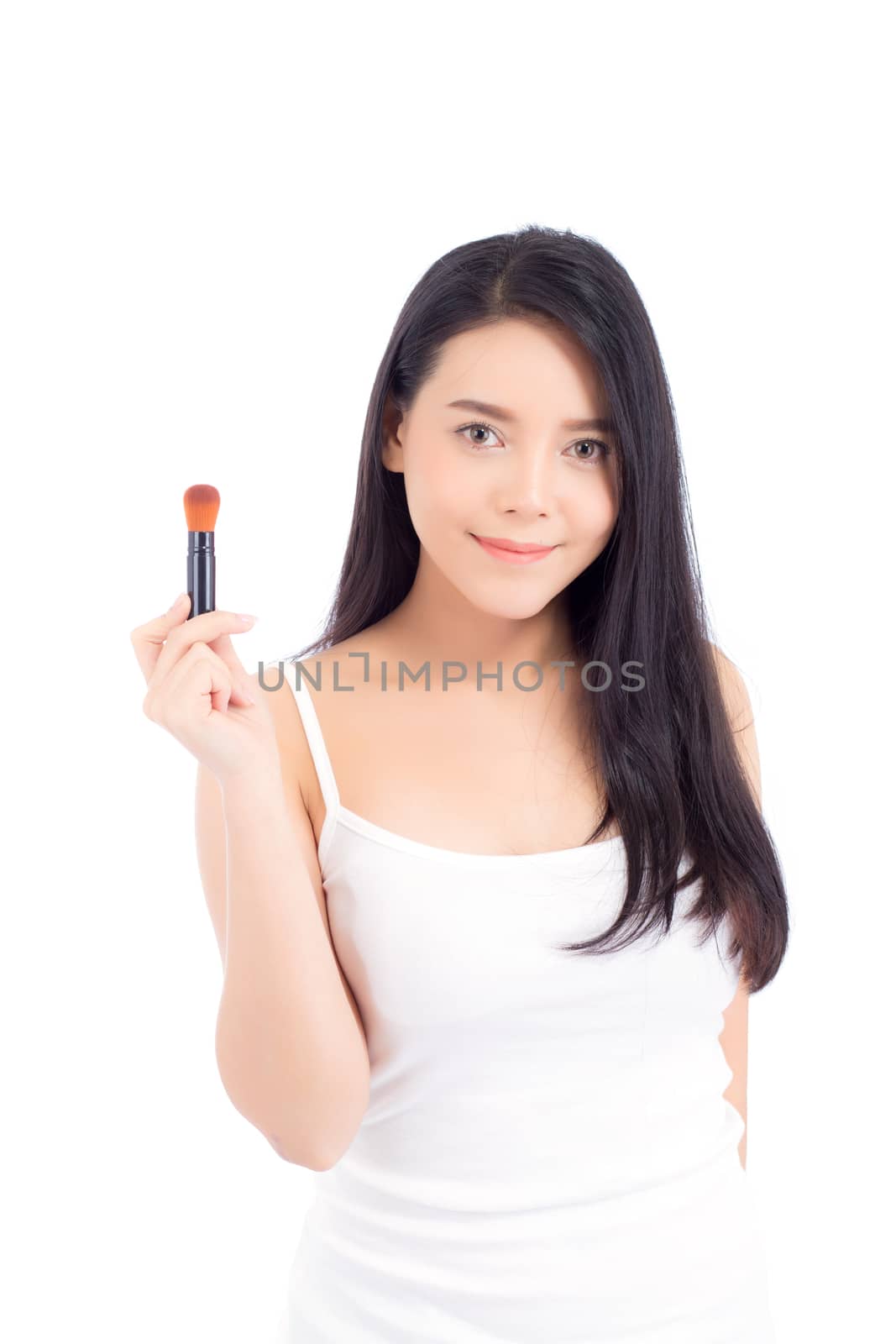 Portrait of beauty asian woman applying make up with brush of cheek isolated on white background, beautiful of girl holding blusher, skincare and cosmetic concept.