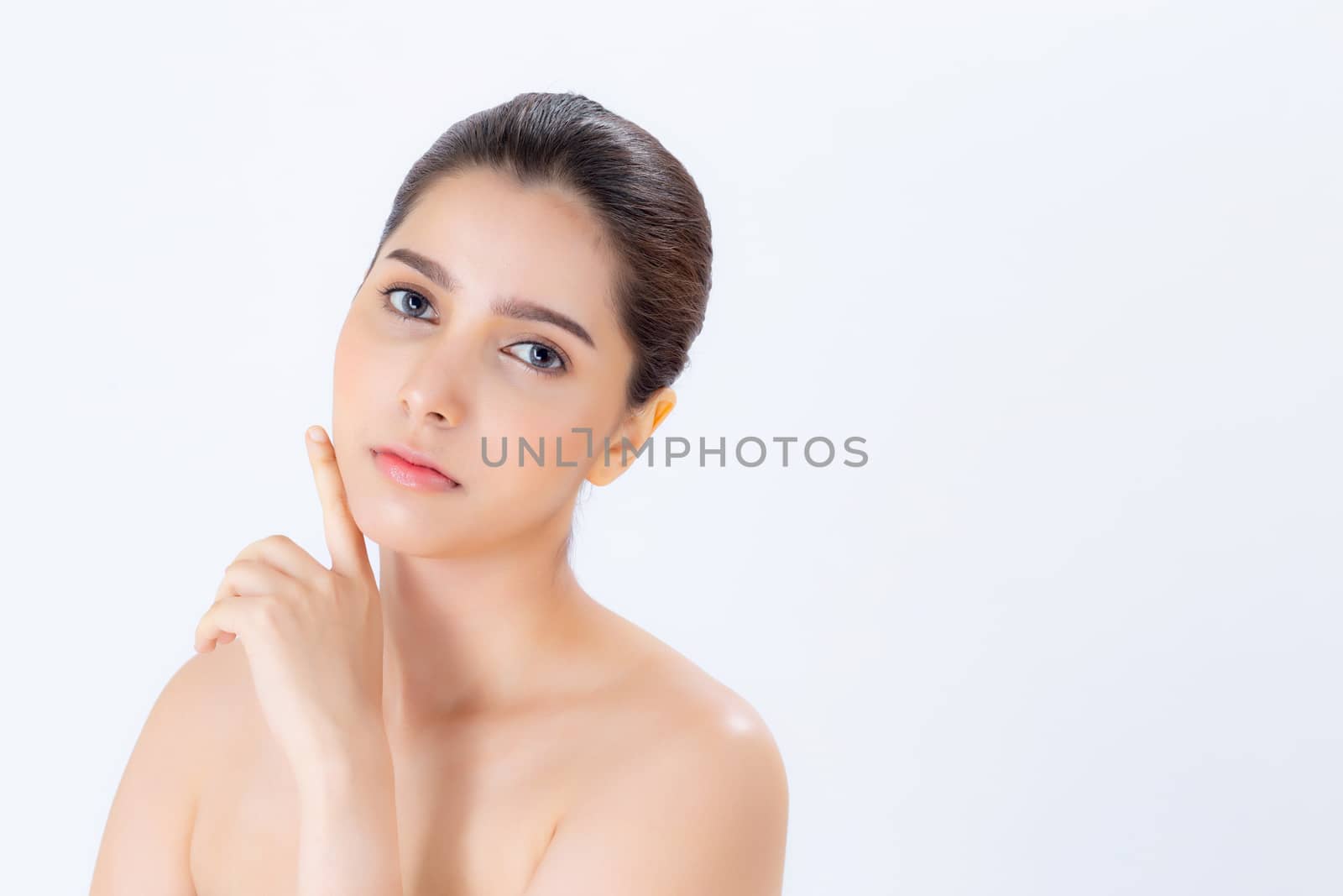 Portrait of beautiful brunette woman makeup of cosmetic, girl hand touch cheek and smile attractive, face of beauty perfect with wellness isolated on white background with skin healthcare concept.