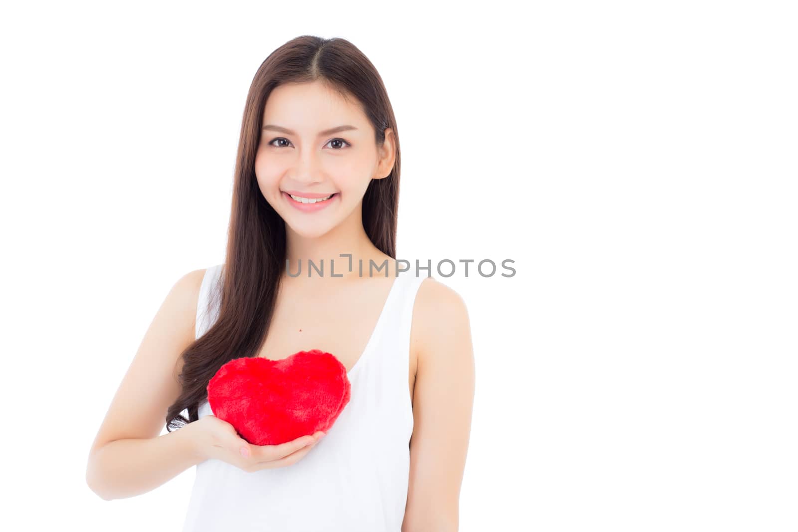 Portrait of beautiful asian young woman holding red heart shape pillow and smile isolated on white background, valentines day, holiday concept.