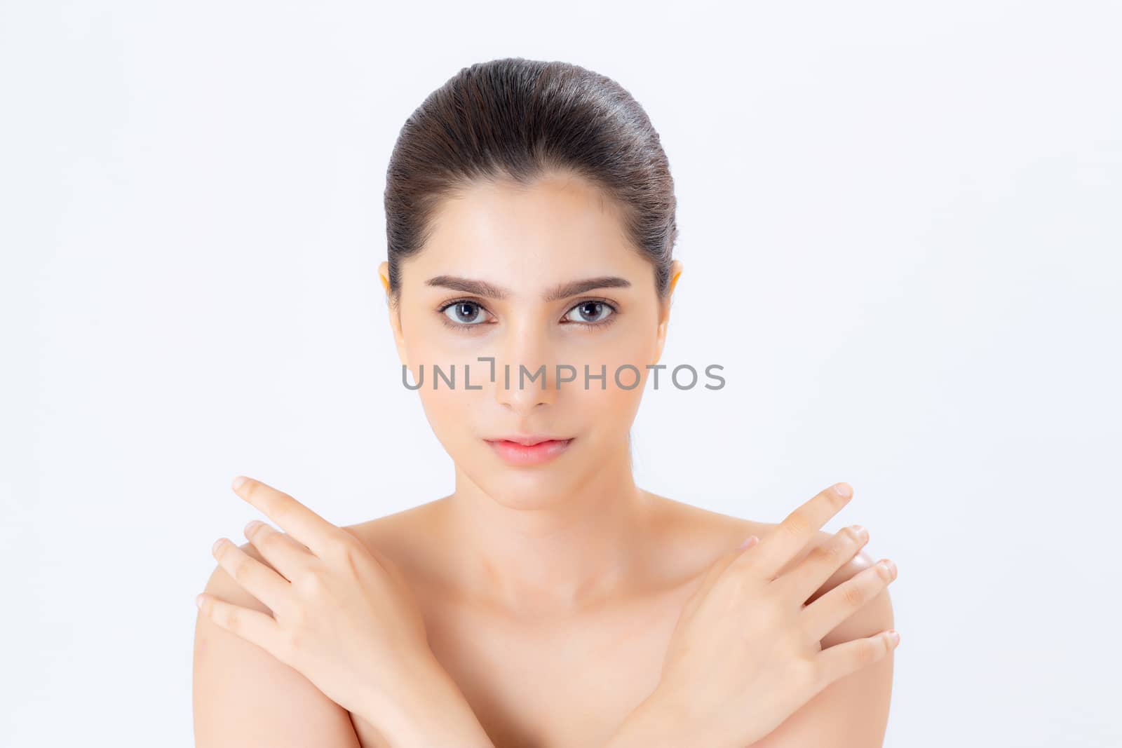 Portrait of beautiful brunette woman makeup of cosmetic, girl hand touch shoulder and smile attractive, face of beauty perfect with wellness isolated on white background with skin healthcare concept.