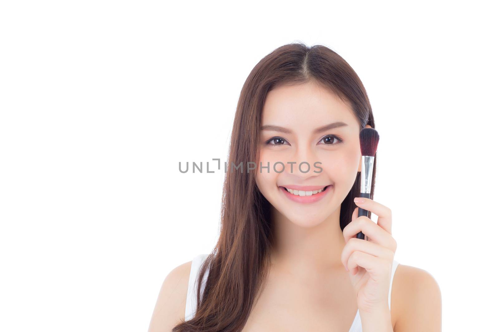 Beauty asian woman applying make up with brush of cheek isolated on white background, beautiful of girl holding blusher, skincare and cosmetic concept.