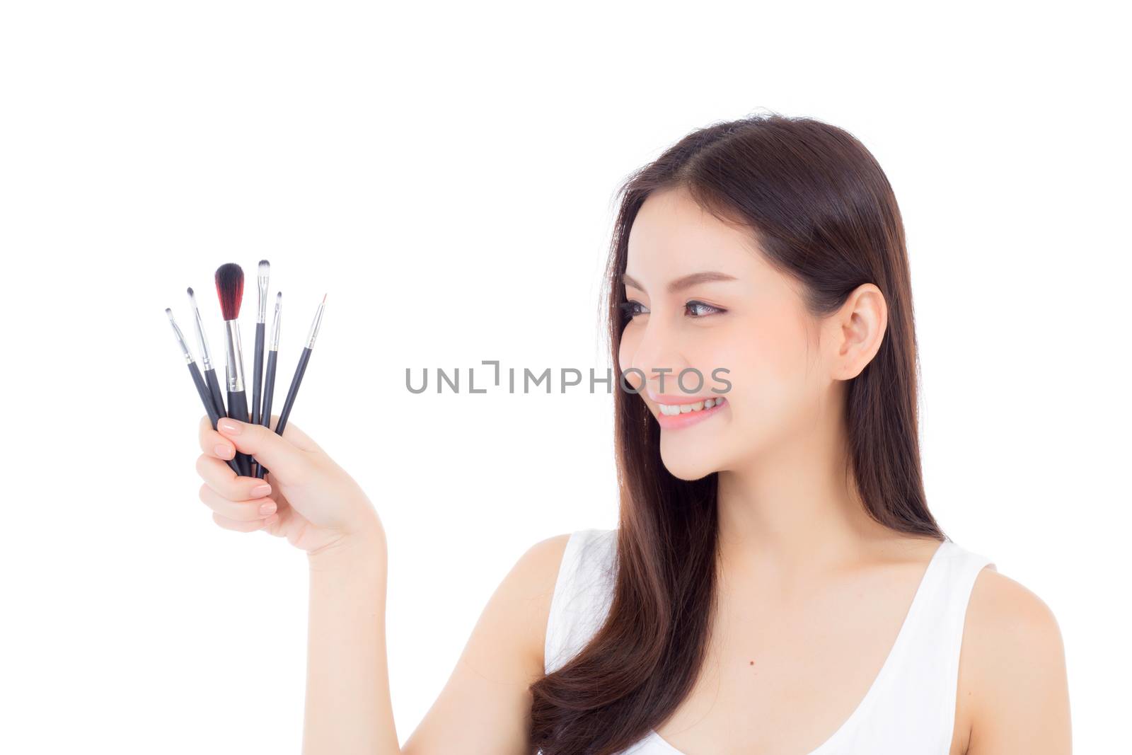 Beauty asian woman applying make up with brush on hand isolated on white background, beautiful of girl holding blusher, skincare and cosmetic concept.