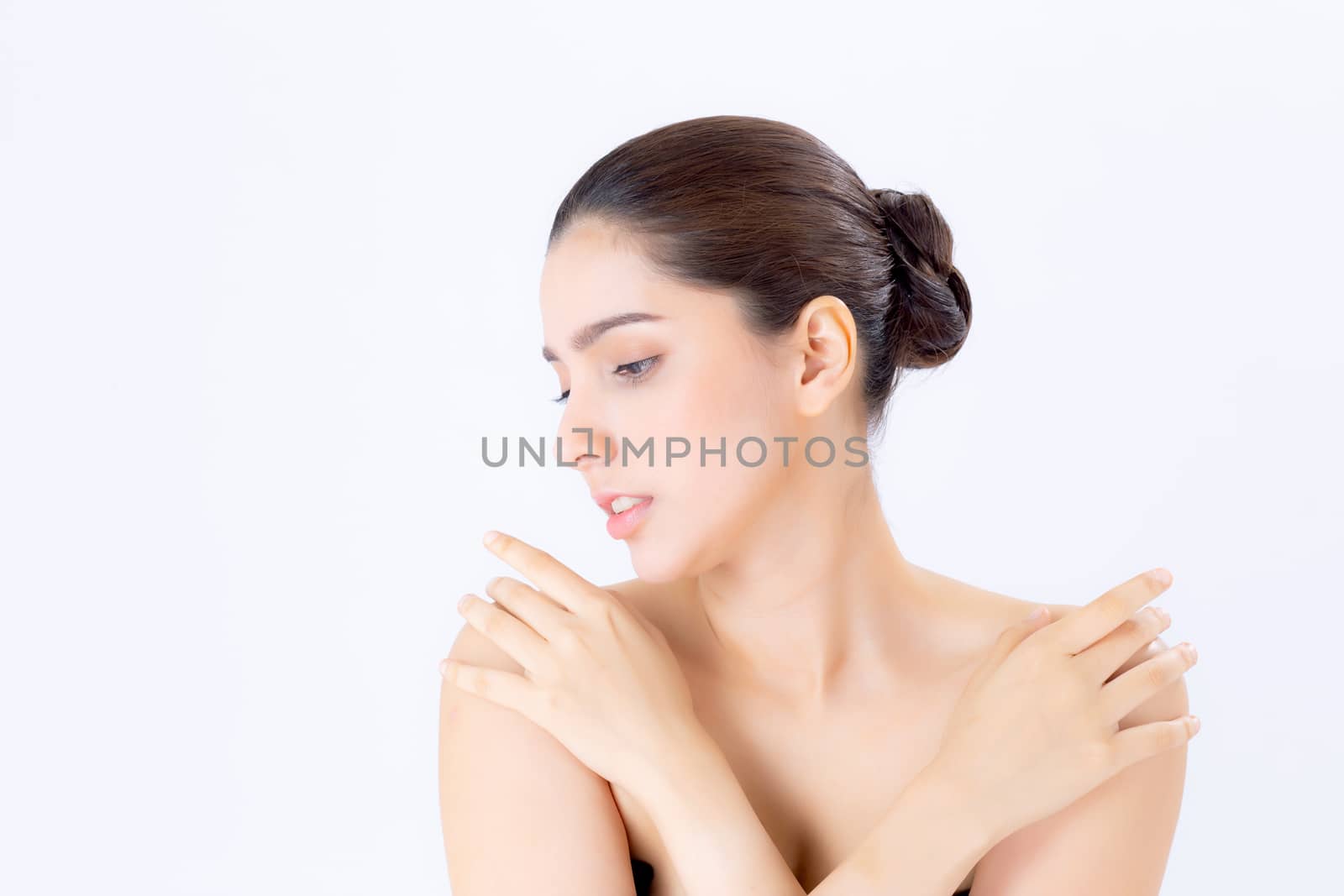 Portrait of beautiful brunette woman makeup of cosmetic, girl hand touch shoulder and smile attractive, face of beauty perfect with wellness isolated on white background with skin healthcare concept.