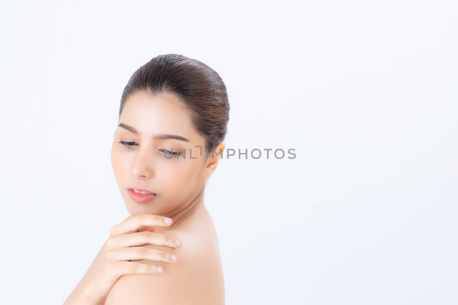 Portrait of beautiful asian woman makeup of cosmetic, girl touch  shoulder and smile attractive, face of beauty perfect with wellness isolated on white background with skin healthcare concept.