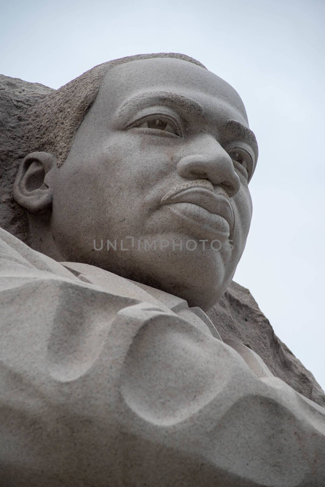 Close up of the national memorial to the great Dr. King, pink granite and a pale blue sky.