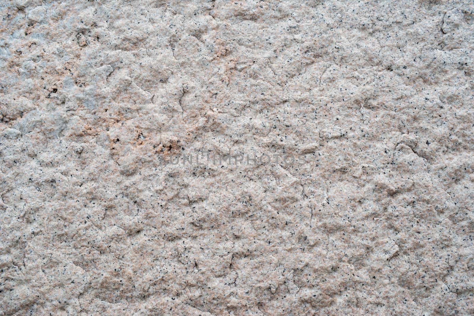 Close up of rough textured pretty pink granite by marysalen