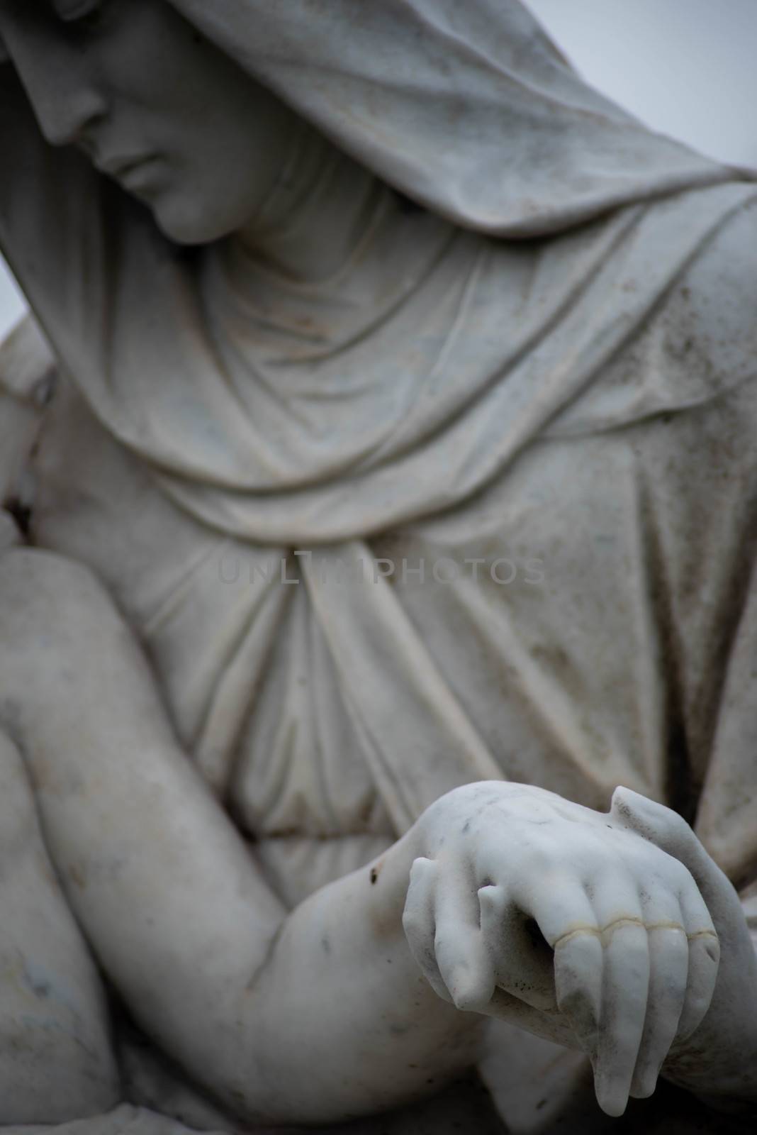 Stone cemetery statue, Mary holding Jesus's hand. by marysalen