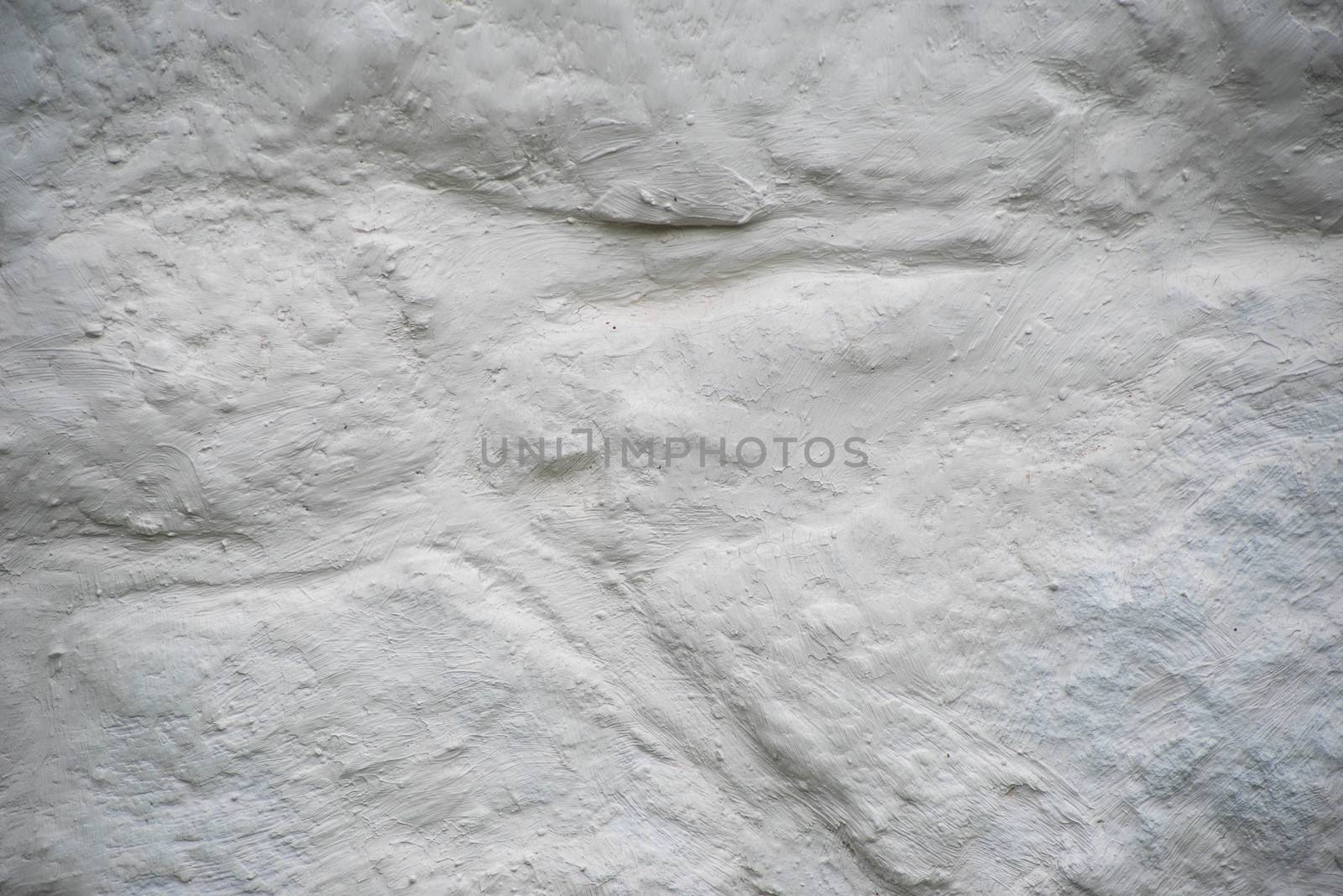 Rough stone texture and hand crafted detail. Whaitewashed colonial stone wall in natureal light with copy space.