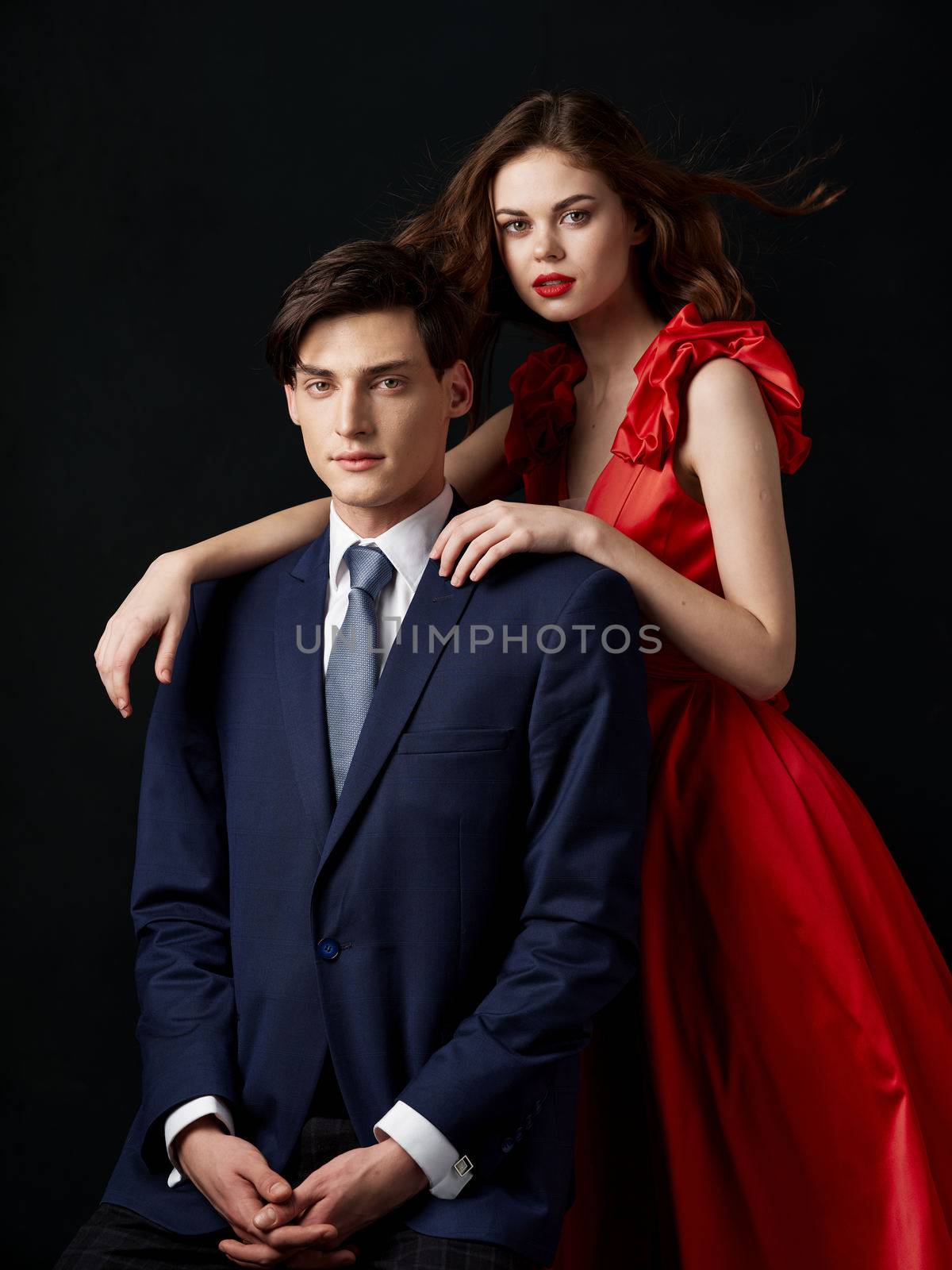 Pin-up couple portrait woman in red dress man in suit by SHOTPRIME