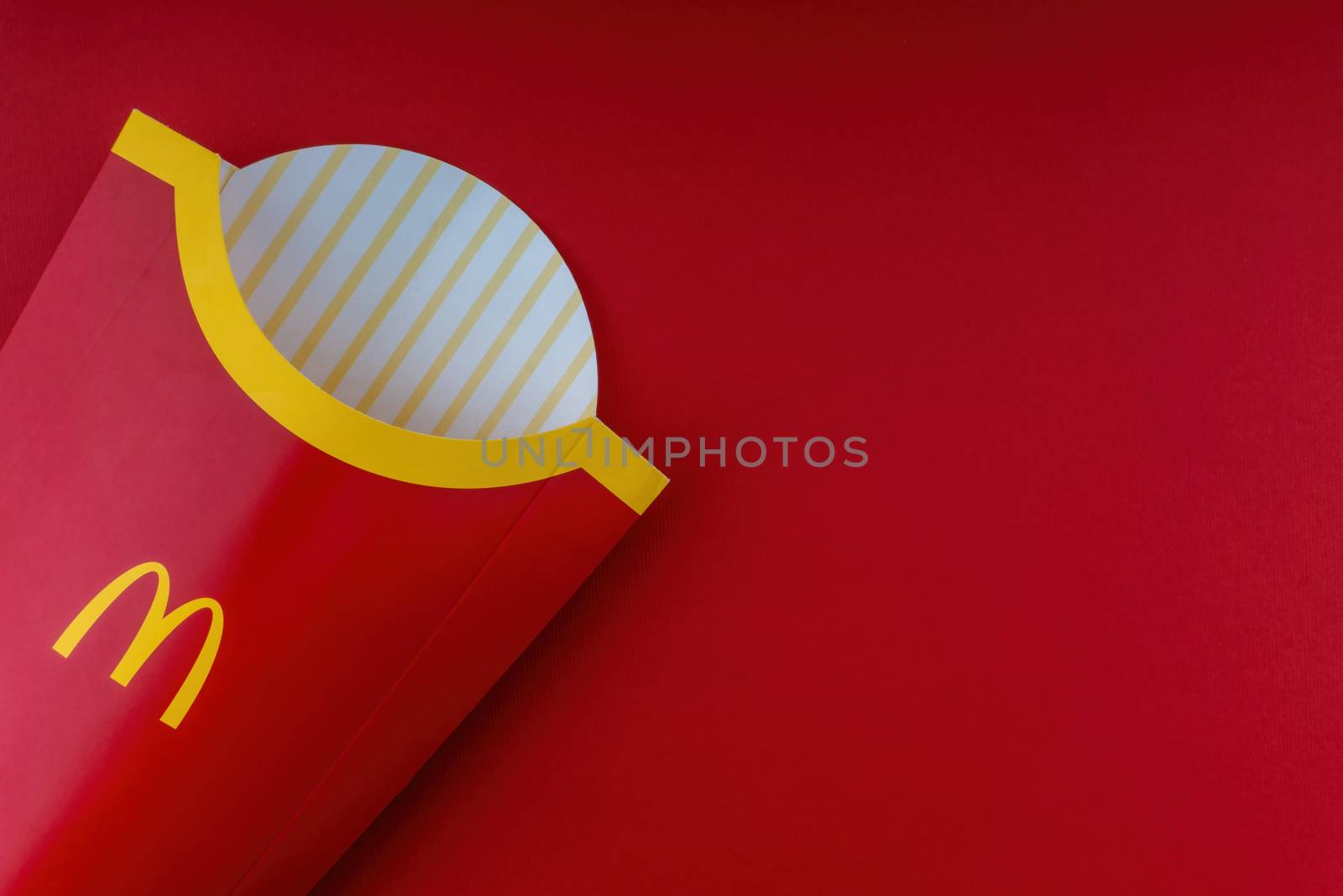 Kuala Lumpur, Malaysia - October 20, 2020 : McDonalds french fries box on red background