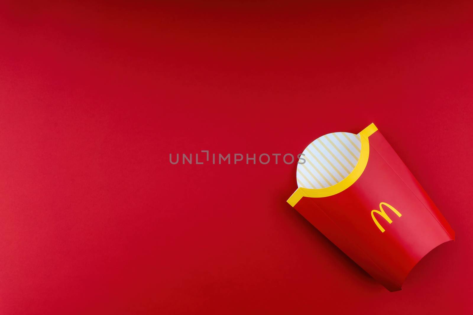Kuala Lumpur, Malaysia - October 20, 2020 : McDonalds french fries box on red background