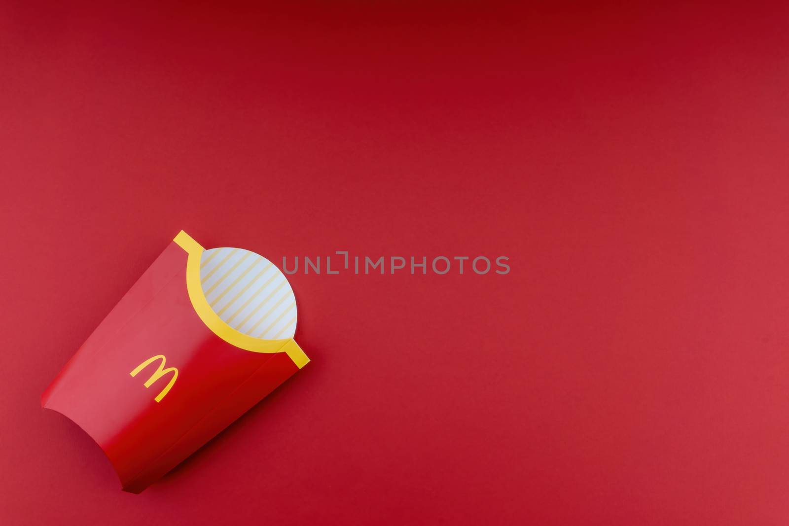 Kuala Lumpur, Malaysia - October 20, 2020 : McDonalds french fries box on red background