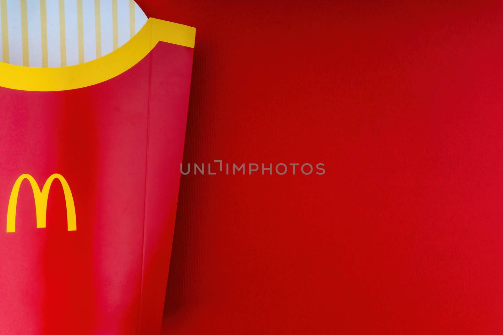 Kuala Lumpur, Malaysia - October 20, 2020 : McDonalds french fries box on red background
