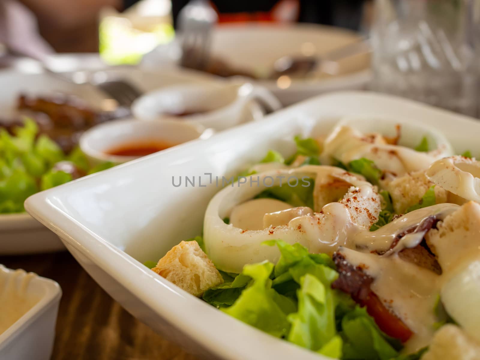 Close up vegetable salad On a white plate Has a blurred backgrou by Unimages2527