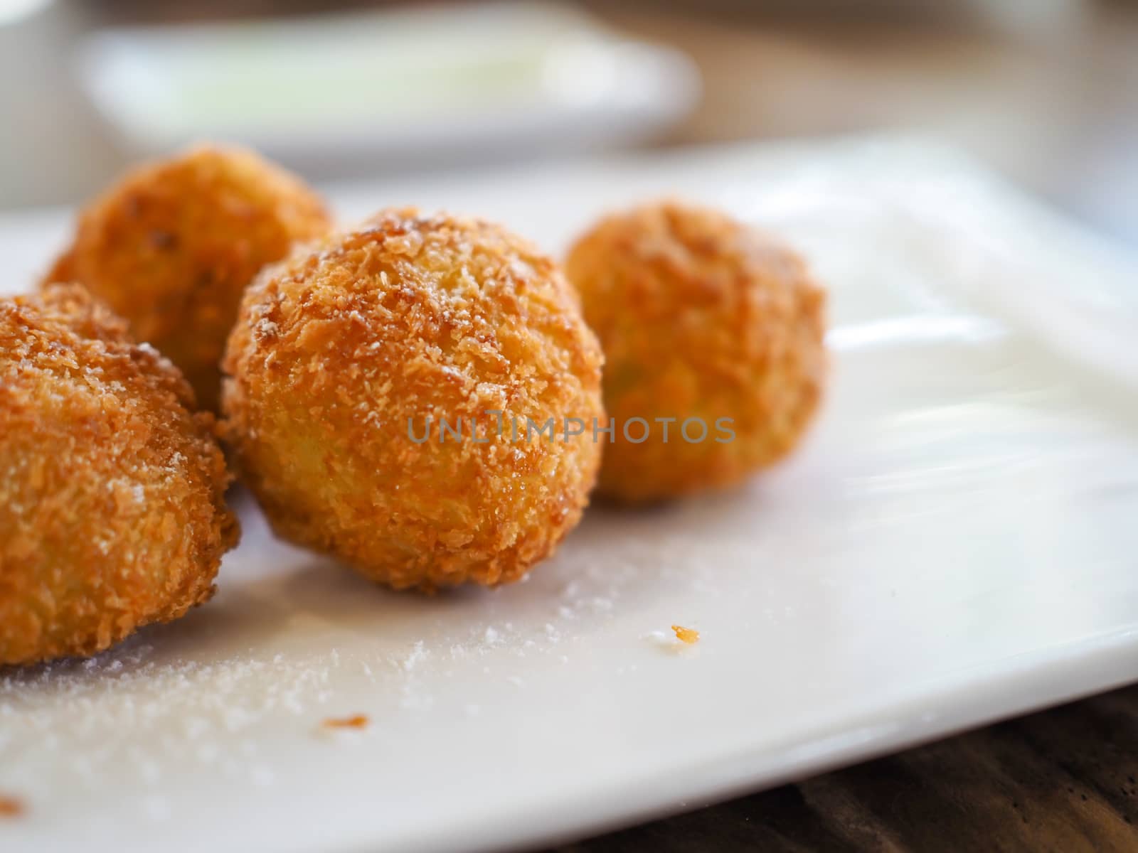 The cheese ball is on a white plate. with copy space.