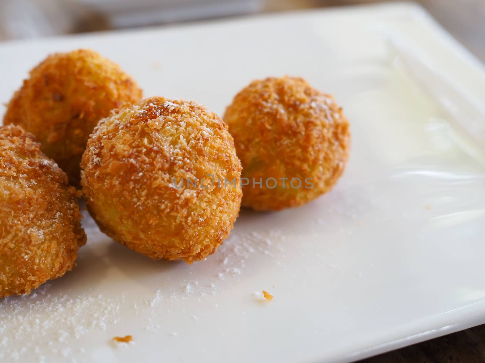 The cheese ball is on a white plate. with copy space.