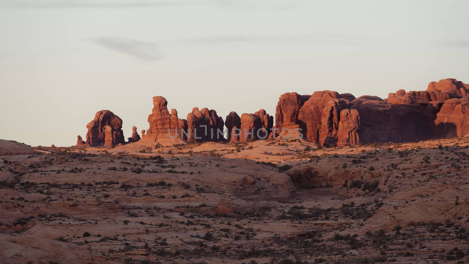 Warm sunset light on ancient sand stone spires, Arches National Park, Utah.