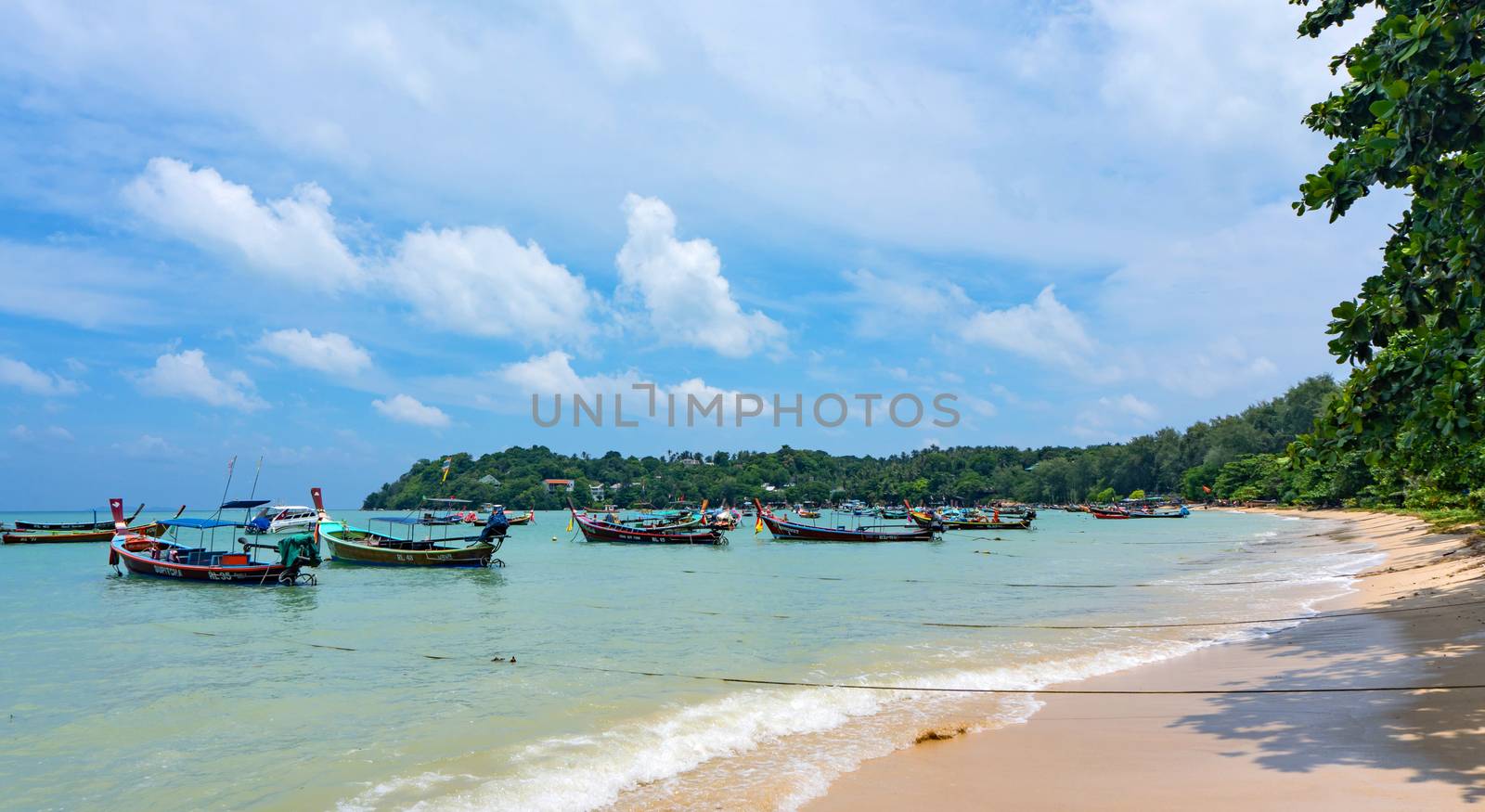 Fishing boats moored at Chalong Bay Pier. by pkproject