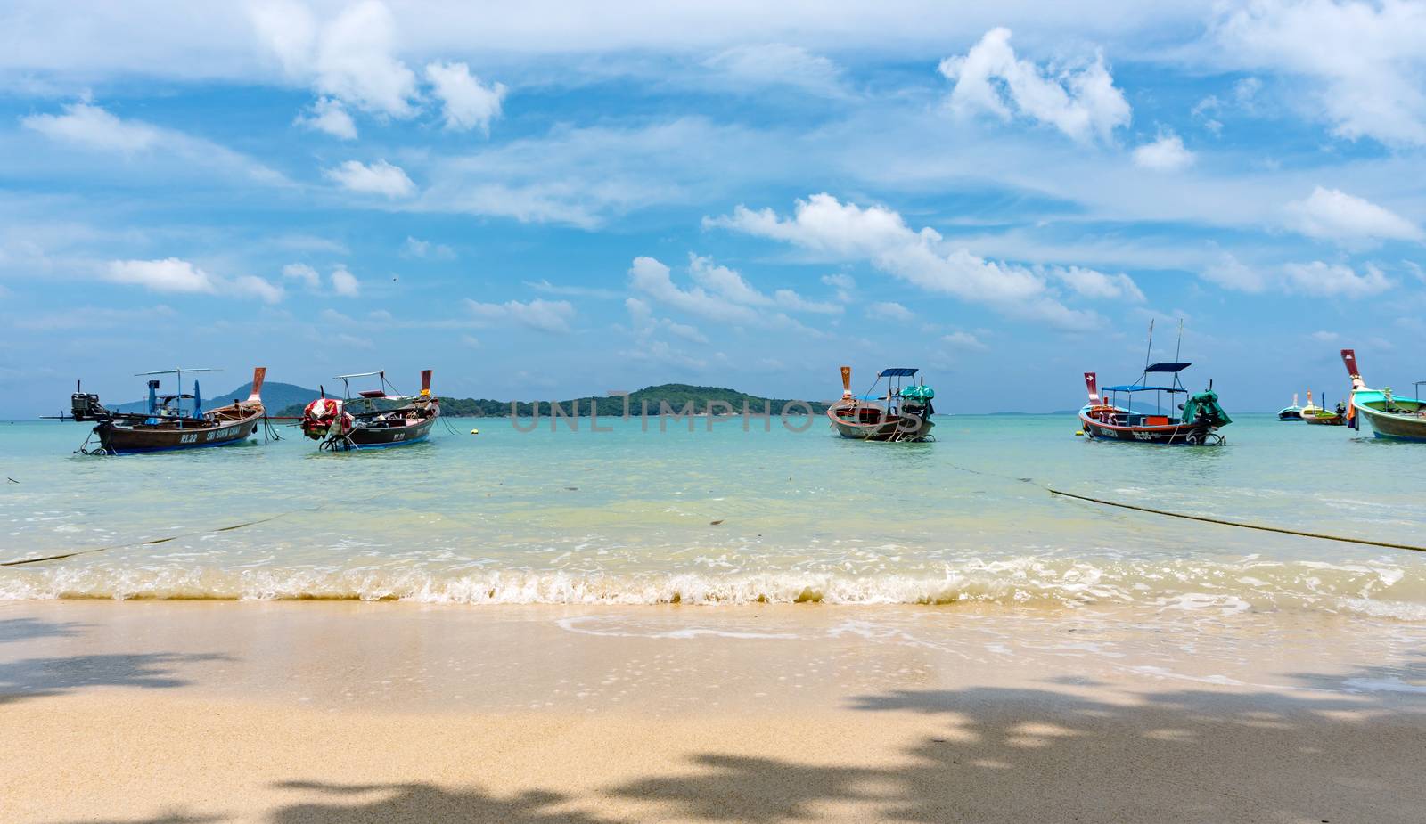 Phuket, Thailand - 06 August 2020: Fishing boats moored at Chalong Bay Pier.