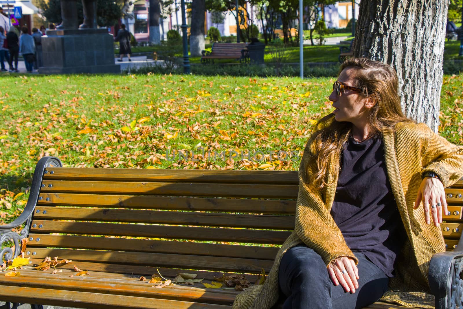 Beautiful young woman in the park, autumn nature and ginger hair woman.