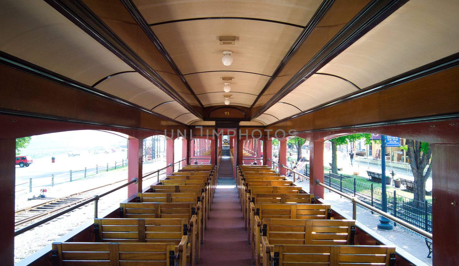 Antique Open Air Passenger Car Interior with Wooden Seats