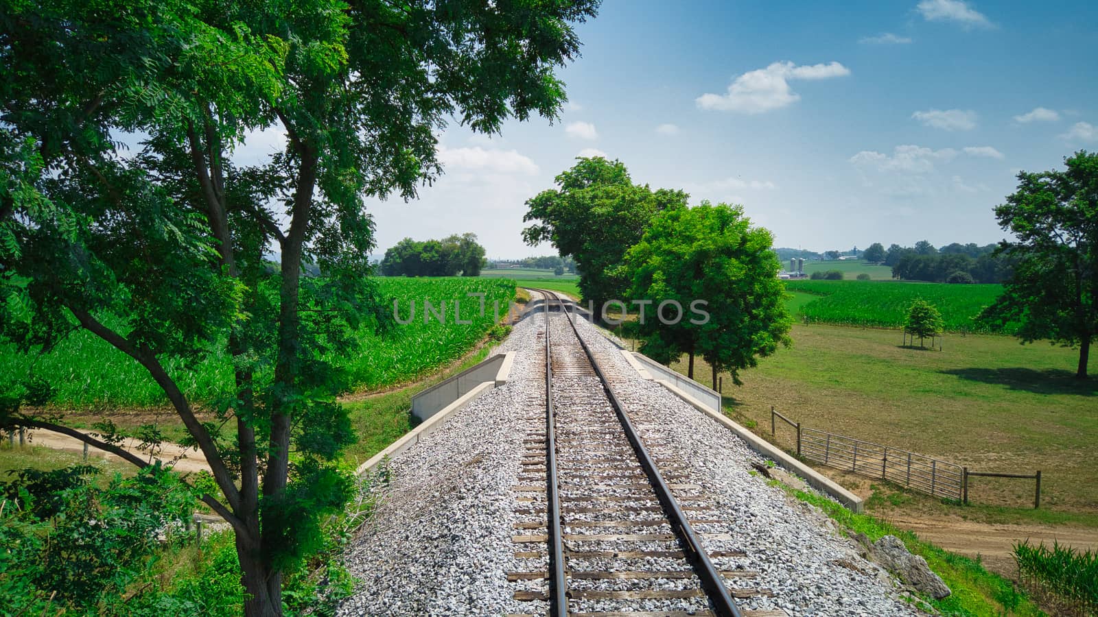 Old Rail Road Track going Thru Countryside on a Sunny Day