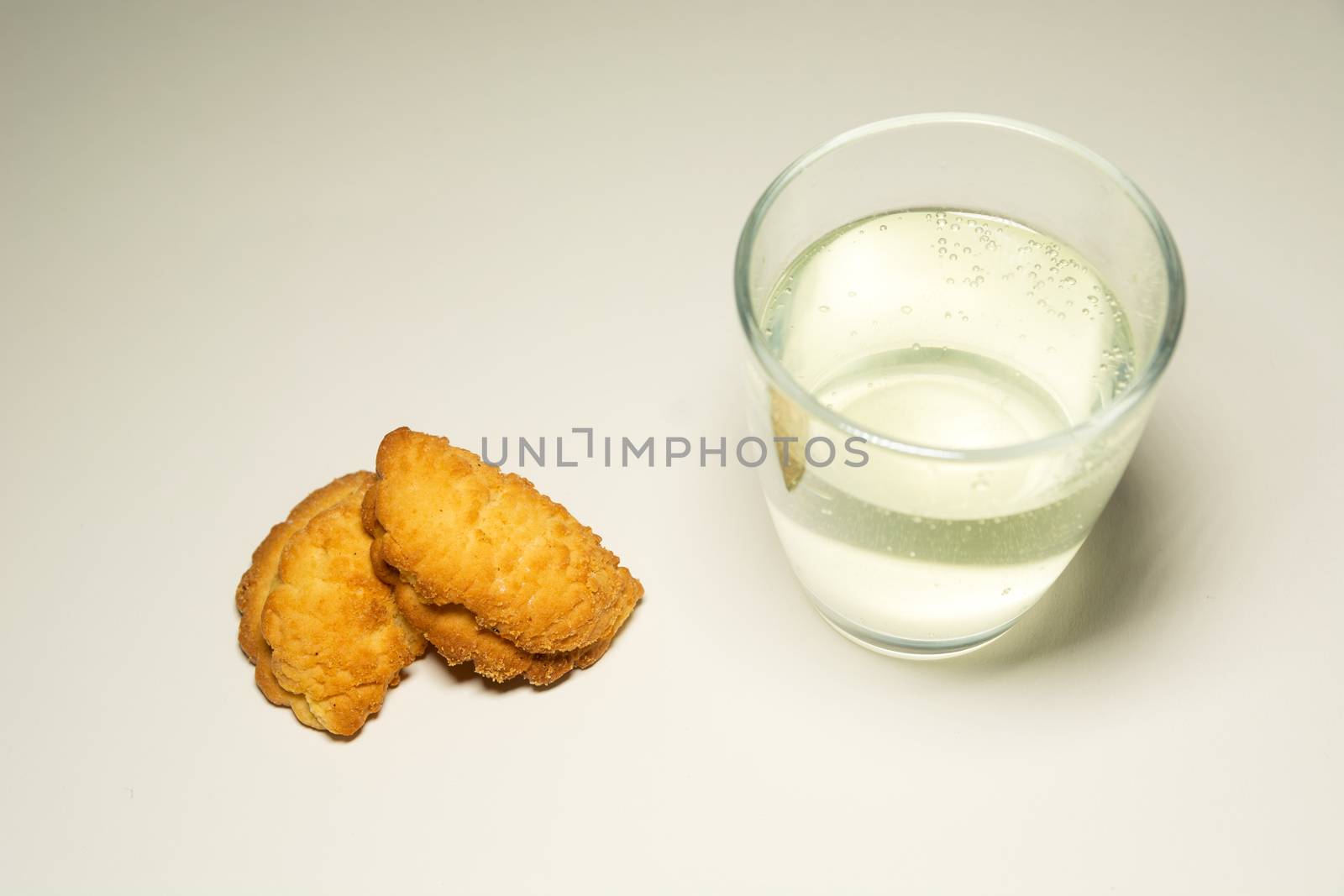 Cakes and soda in a glass, top view