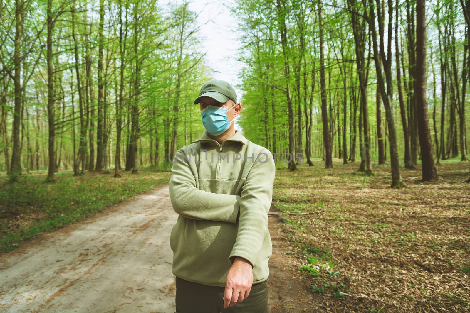 A man in a mask standing in the forest by darekb22