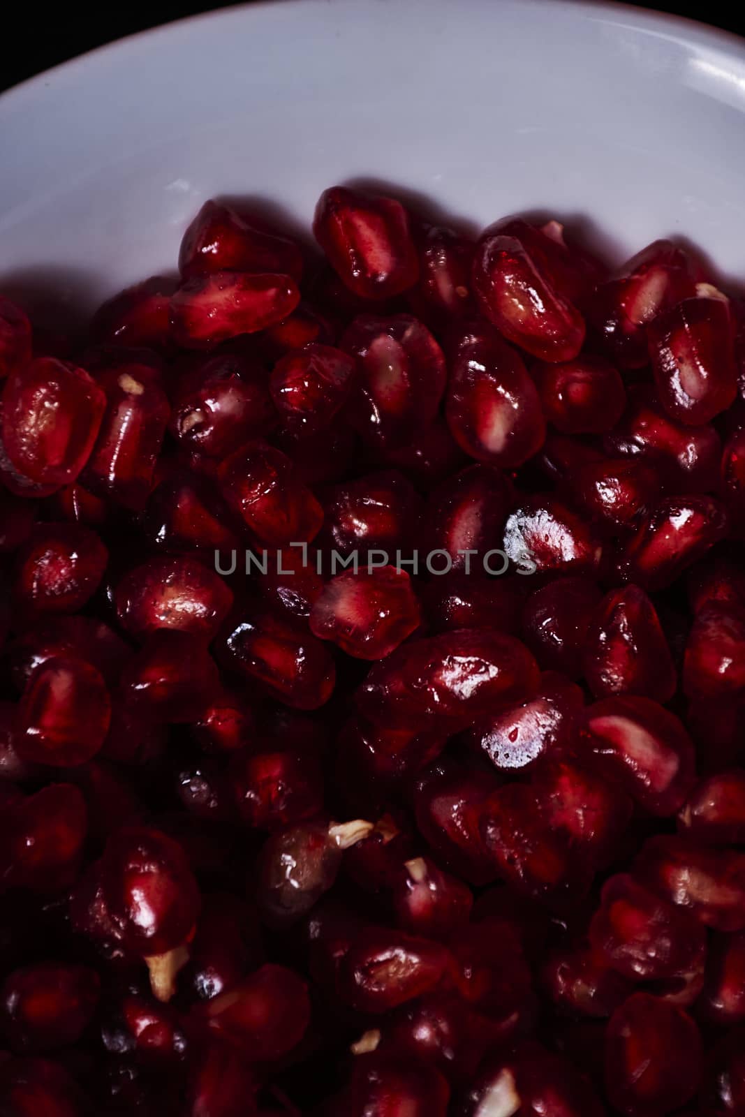 Pomegranate seeds close-up, Black background, macro photography