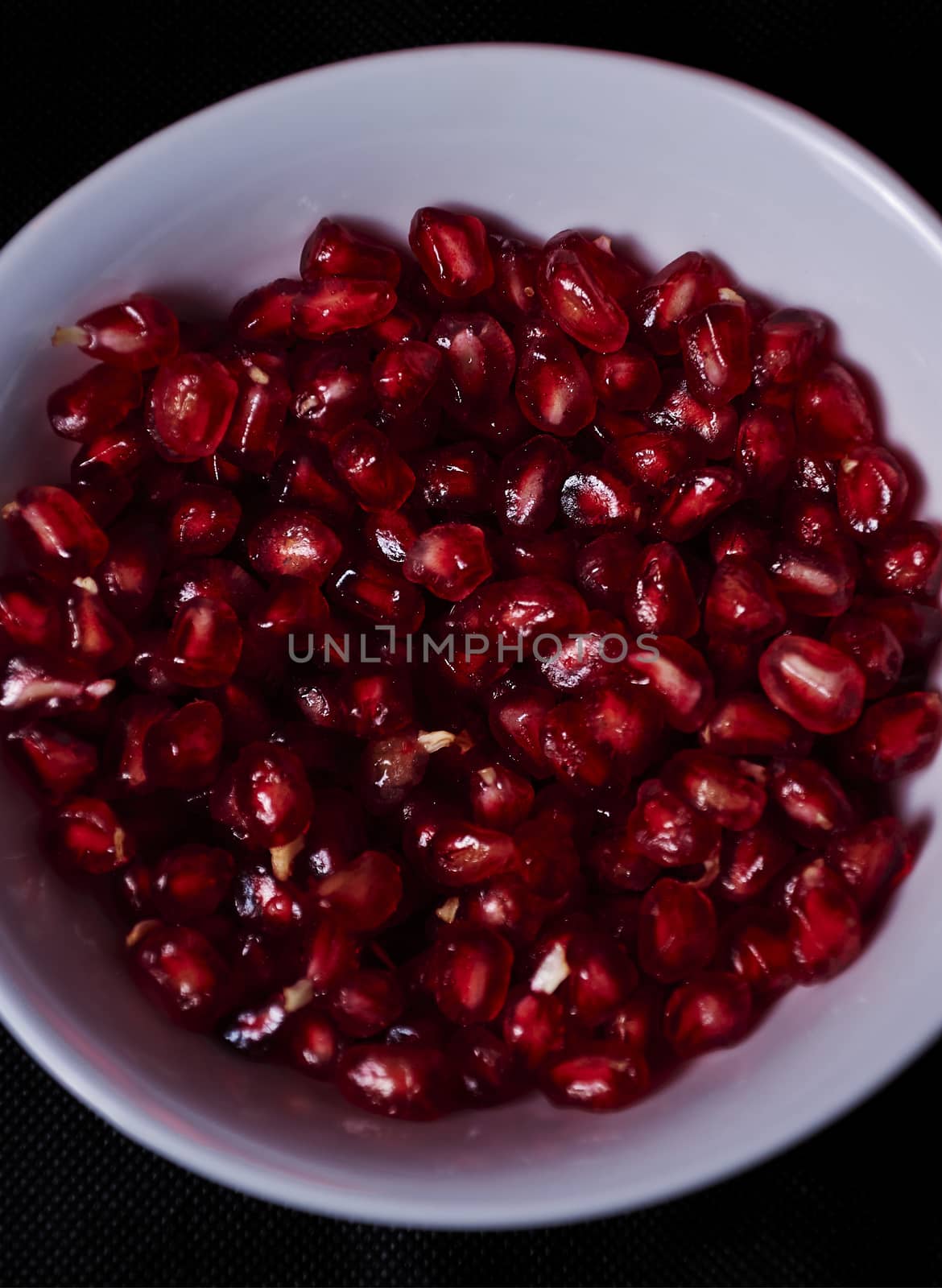 Pomegranate seeds close-up, Black background, macro photography