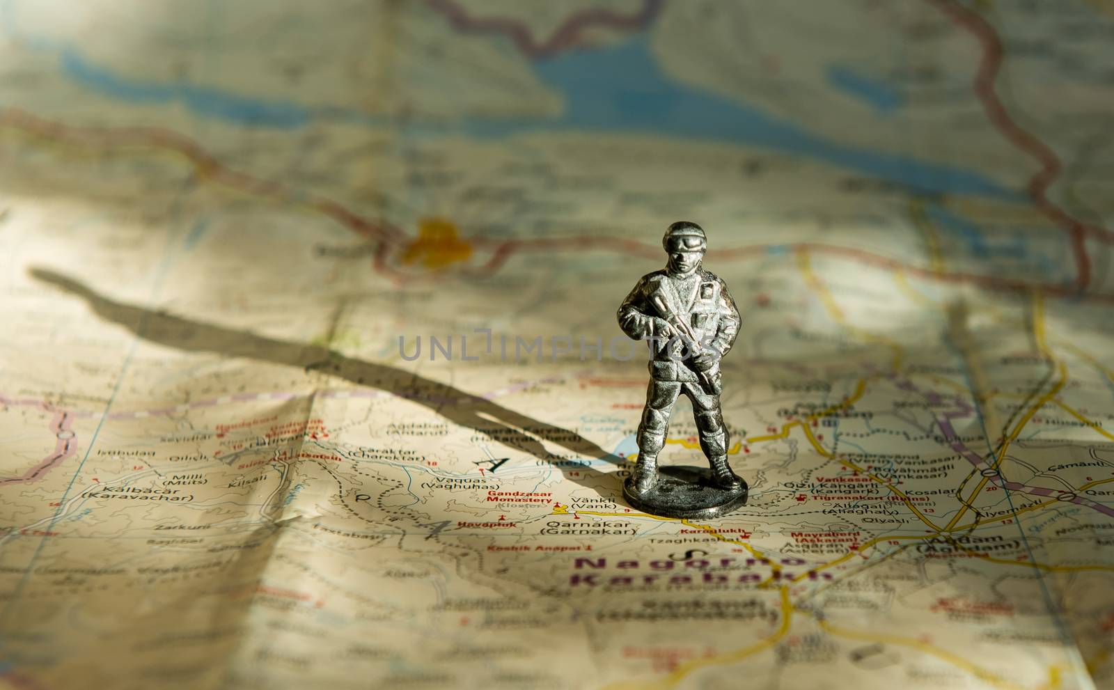 A figurine of an armed soldier on the map of Nagorno-Karabakh.