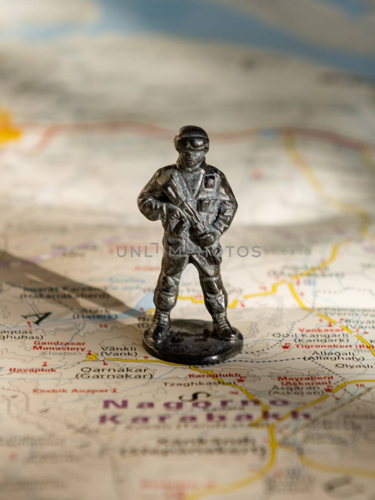 A figurine of an armed soldier on the map of Nagorno-Karabakh.